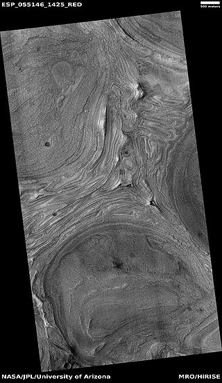 Wide view of features on floor of Hellas impact basin. The exact origin of these shapes is unknown at present.